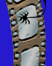 cartoon image of old film strip with spider and cobweb on it; link for joke-cartoon, ZOMBIE NEWS CLIPS FROM THE TOMB OF THE UNREAL, VOLUME 3 - THE FOOD CHRONICLES