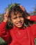 picture of girl playing in grass; link for environmental article, Chemical Pesticide Exposure and Effects on Children