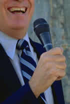 picture of politician with microphone to his mouth