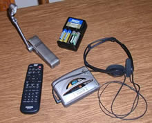 picture of battery-powered devices, including walkman and book light