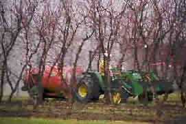 picture of pesticide spraying operation on almond farm