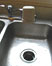 thumb image of sink with garbage disposal; link for environmental article, Avoid Garbage Disposal Problems by Limiting the Waste Going Down the Sink