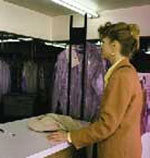picture of woman picking up dry cleaning