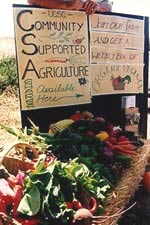 picture of farmers market sign that says Community Supported Agriculture