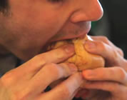 funny sandwich video link; thumb of man biting sandwich
