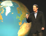 al gore next to huge photo of earth