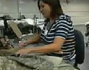 funny prison labor video link; thumb of prisoner using a sewing machine