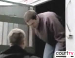 funny stupid criminal video link; thumb of arrested man getting out of paddy wagon