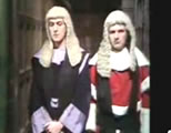 funny judges video link; thumb of Eric Idle and Michael Palin as poofy judges