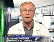 funny GMO video link; thumb of fake scientist on news screen