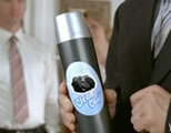 man in suit holding can of 'clean coal' air freshener; click to go to funny video page at external site; opens in new window