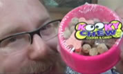 photo of a man with a toy bowl of dog food for kids; click to see animation on YouTube; opens in new window